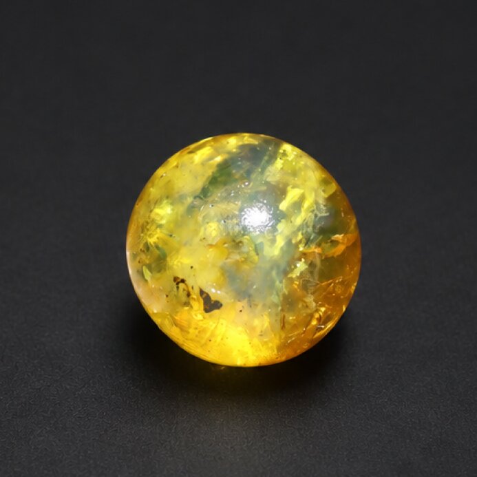 Untreated olive green yellow Dominican amber sphere/ball 18.7mm