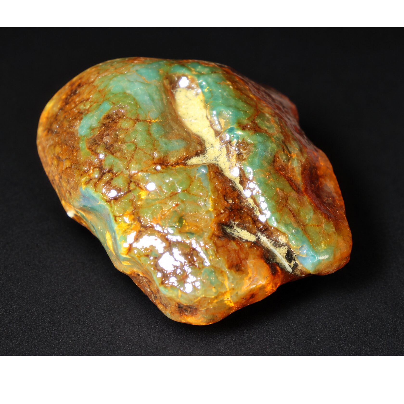Authentic deep blue rough specimen Dominican amber 32mm