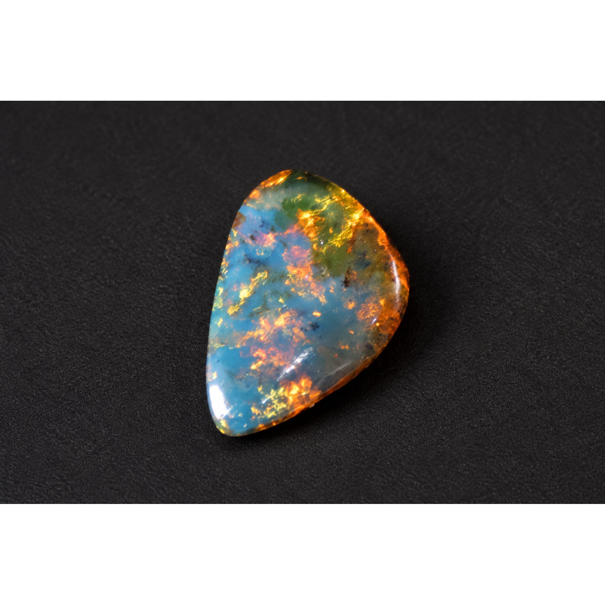 Nature created orange blue Dominican amber cabochon – photo 6